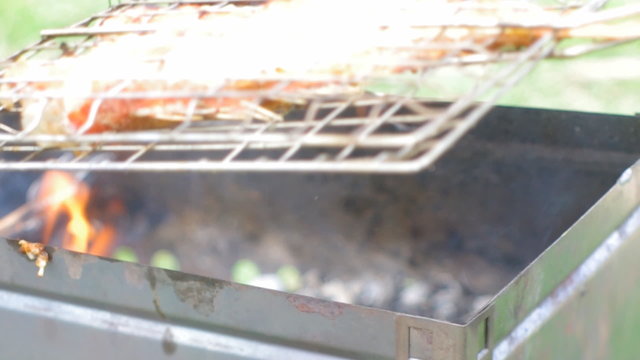  barbecue .Rock Fish on the grill with flames . grilling sea fis