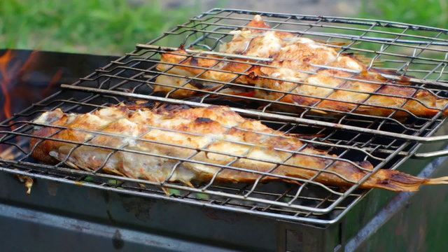  barbecue .Rock Fish on the grill with flames . grilling sea fis