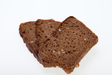 Slices of dark bread isolated over white