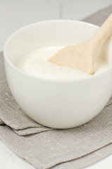 Sour cream in the white bowl