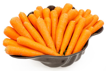 Large black bowl full of ripe and fresh carrots, isolated