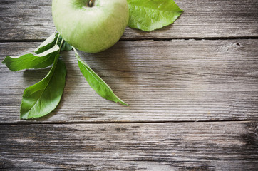 green apple on wooden background