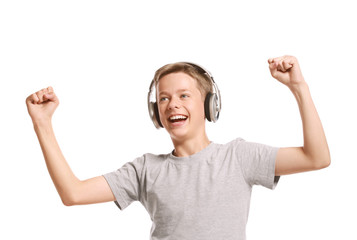 Smiling teenage boy listening to music