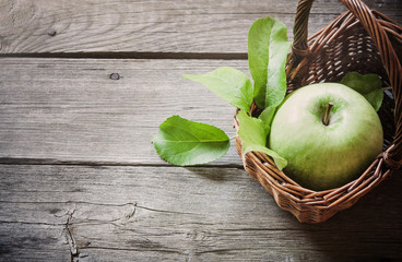 green apple on wooden background