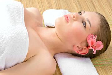 Obraz na płótnie Canvas Facial skincare. Lovely young woman relaxing in spa salon