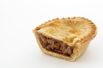 Savoury meat pie cut in half to show the succulent beef filling