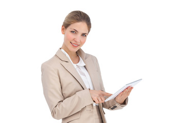 Smiling businesswoman using a digital tablet