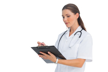 Nurse writing on her clipboard