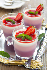 Panna cotta with strawberries and blueberries.