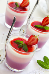 Panna cotta with strawberries and blueberries.