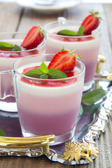 Panna cotta with strawberries and blueberries.