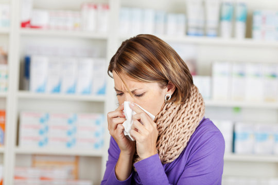 Woman with flu in the pharmacy