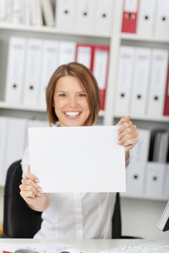 Businesswoman show white blank paper