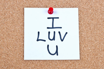 Post it note on wood