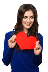 Young woman holding Valentines Day heart sign with copy space