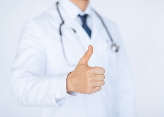 male doctor hand showing thumbs up