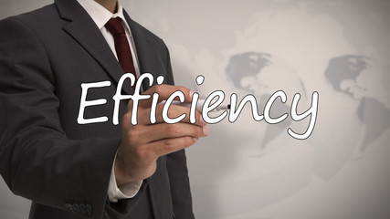 Businessman writing the word efficiency