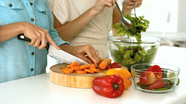 Women preparing a vegetarian salad