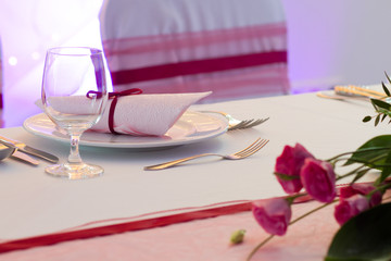 Fototapeta na wymiar luxury place setting, purple napkin on plate