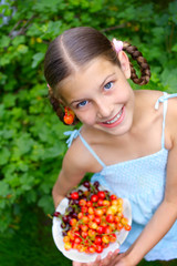 Girl eating cherries