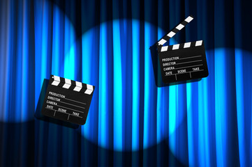 Movie clapper board against curtain