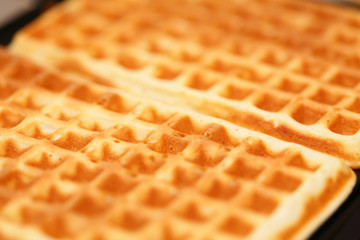 Sweet belgian waffles as background