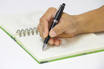 Writing an appointment on the empty notebook