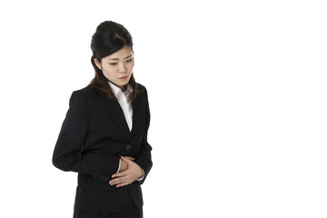 business woman suffering from abdominal pain