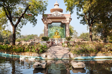 Fototapeta na wymiar Golden Buddha in the park