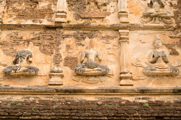 Ancient Buddha statue on Old pagoda in the Ancient buddhist temp