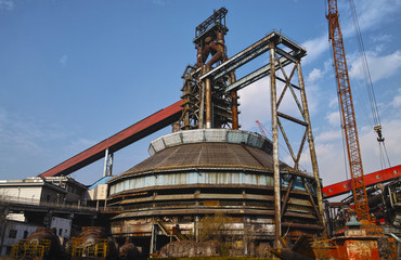 Fototapeta premium Abandoned steelmaking equipments under the sunshine