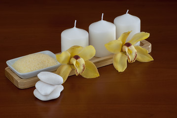 Fototapeta na wymiar yellow orchid and candles