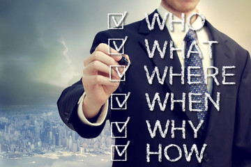 Businessman with who what where when why and how