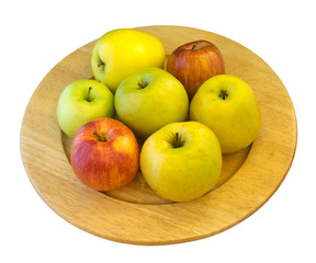 Apples on wooden plate