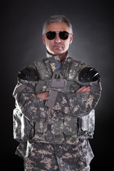 Portrait Of A Mature Soldier Wearing Sunglasses