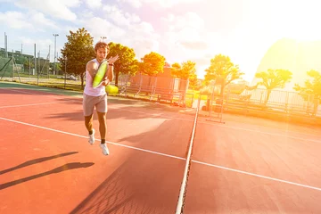 Fotobehang Young Man Playing Tennis © william87