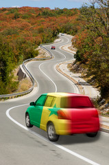 Car on road in  national flag of senegal    colors