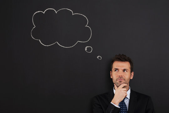 Portrait of pensive and thoughtful businessman