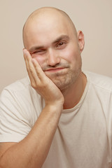 Fototapeta premium Bald man with toothache