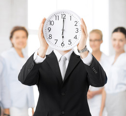 man with wall clock