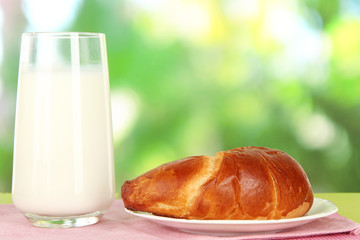 Bread roll and glass of milk