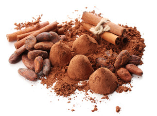 Chocolate truffles, cocoa and spices isolated on white