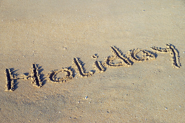 Beach and the word holiday