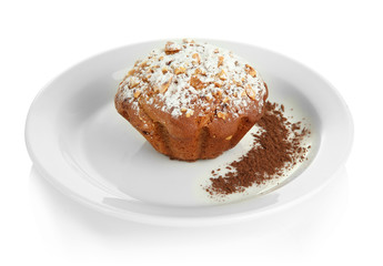 Fototapeta na wymiar Tasty muffin cake with powdered sugar and cocoa