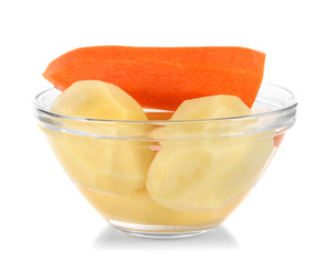 Peeled vegetables in bowl isolated on white