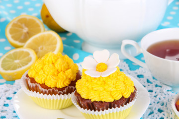 Beautiful lemon cupcakes and flavored tea