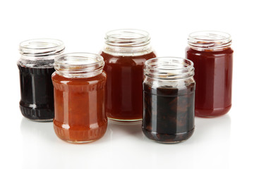 Tasty jam in banks isolated on white