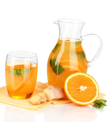 Orange lemonade in pitcher and glass isolated on white