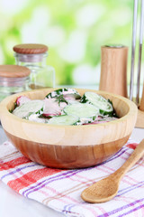 Vitamin vegetable salad in wooden bowl