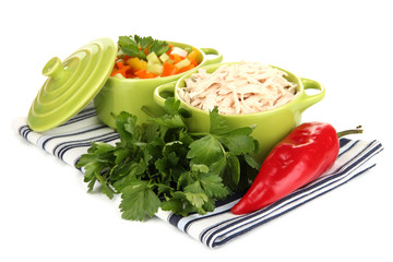 Shredded boiled chicken in green pan isolated on white